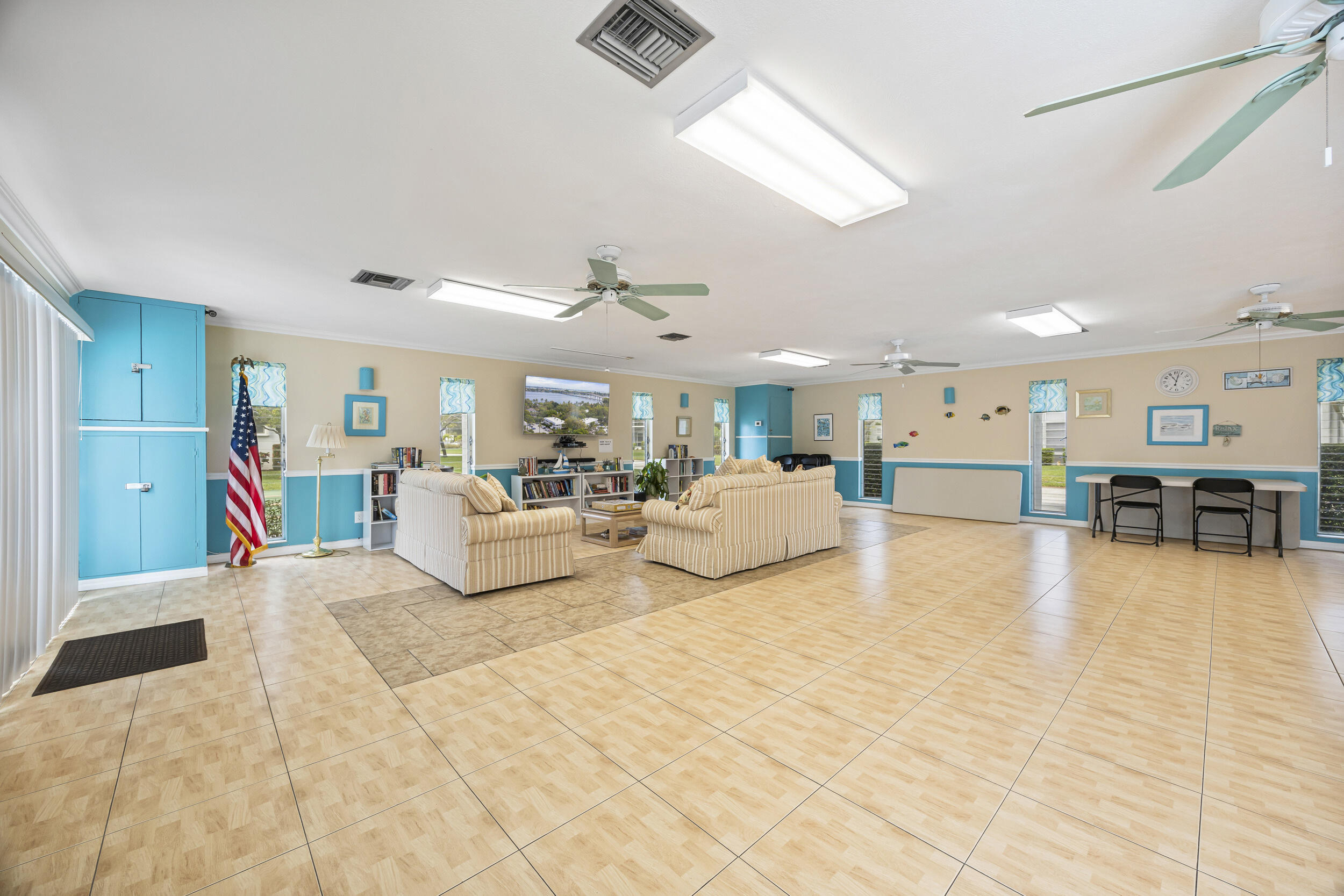 2929 Southeast Ocean Boulevard, Unit 10510 Stuart, FL 34996 - Photo 25 of 37 a living room with furniture and kitchen view
