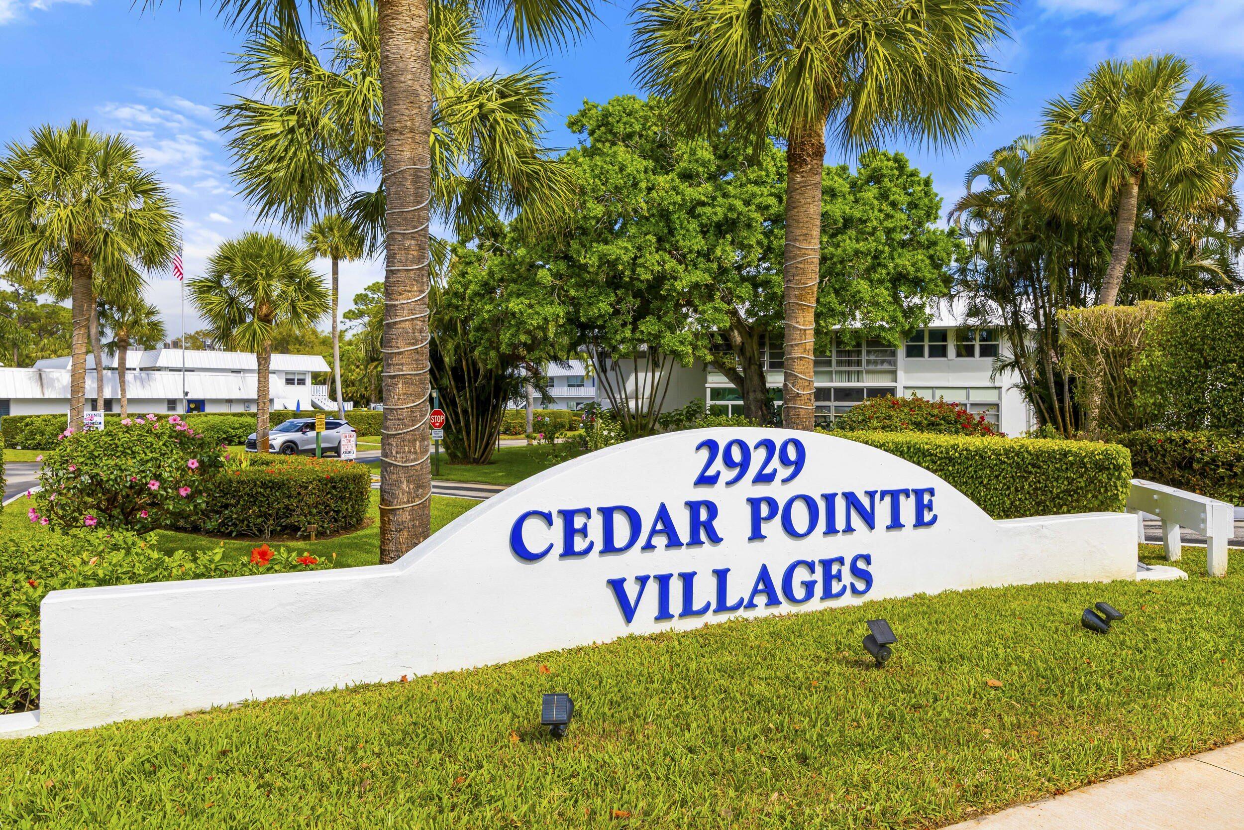 2929 Southeast Ocean Boulevard, Unit 10510 Stuart, FL 34996 - Photo 37 of 37 a sign of golf club on a wall under a tree