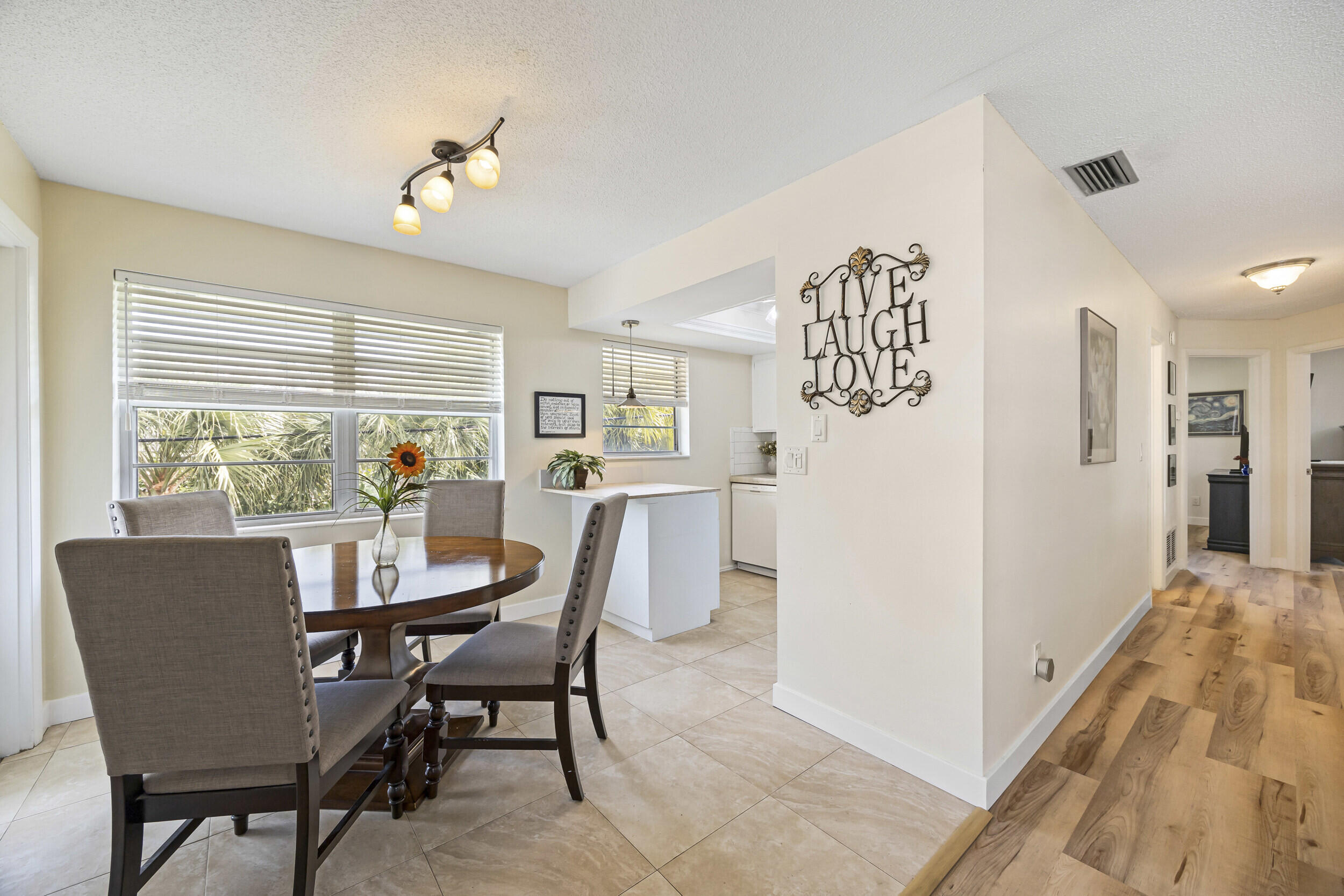 2929 Southeast Ocean Boulevard, Unit 10510 Stuart, FL 34996 - Photo 5 of 37 a view of a dining room with furniture window and outside view
