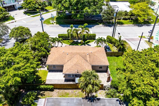a aerial view of a house with a yard and garden
