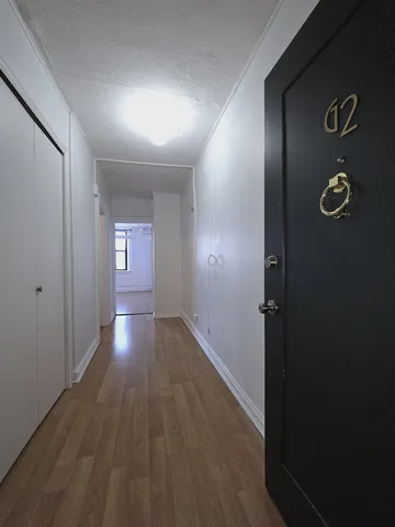 wooden floor in a hall with an entryway