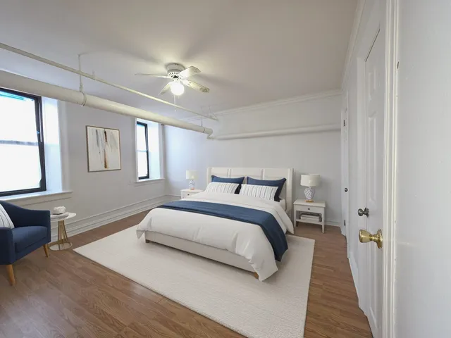 a bedroom with bed and window