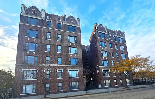 a front view of a building with lot of windows