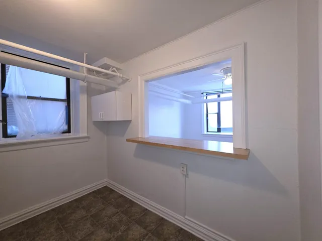 a view of a room that has a window in it