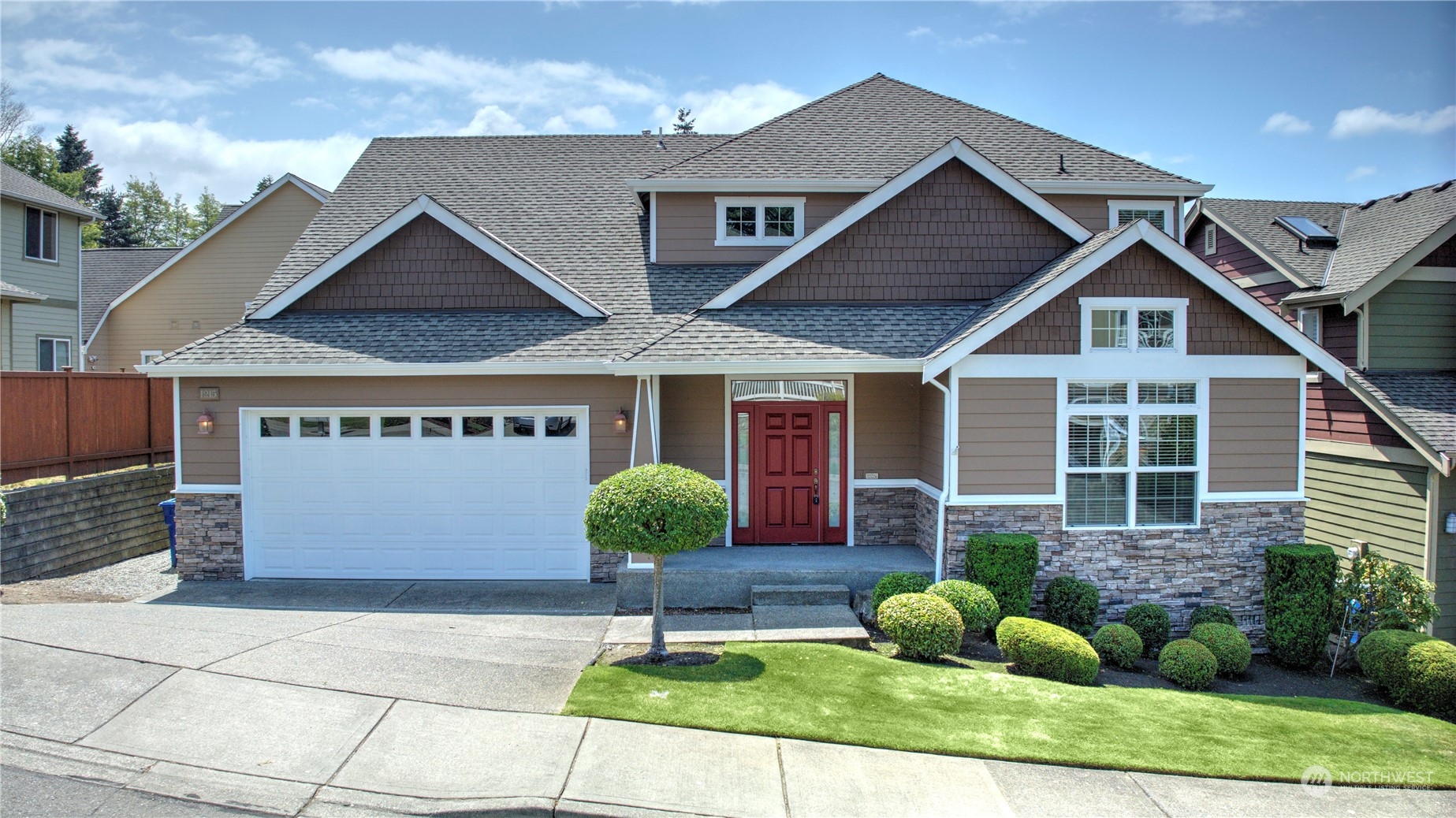 a front view of a house with garden
