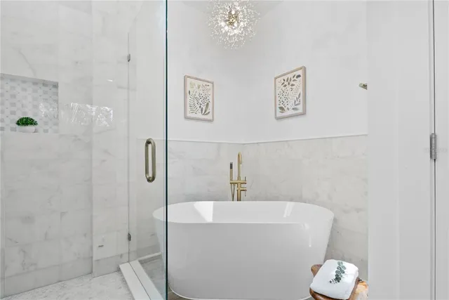 a bathroom with a bathtub and shower