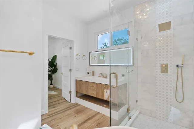 a bathroom with a double vanity sink and mirror
