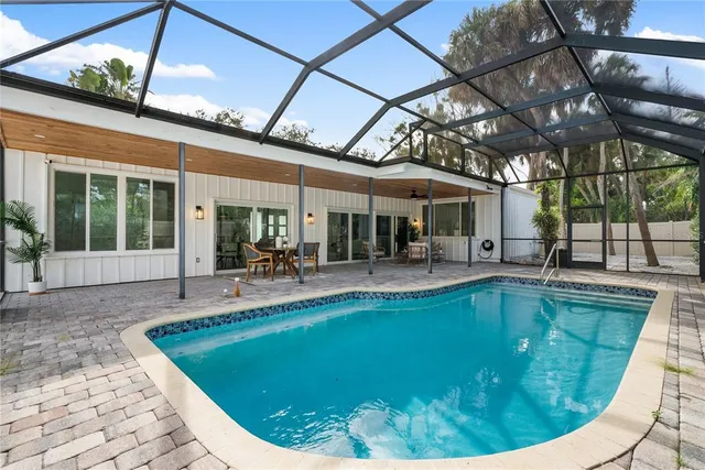a view of a swimming pool with a patio