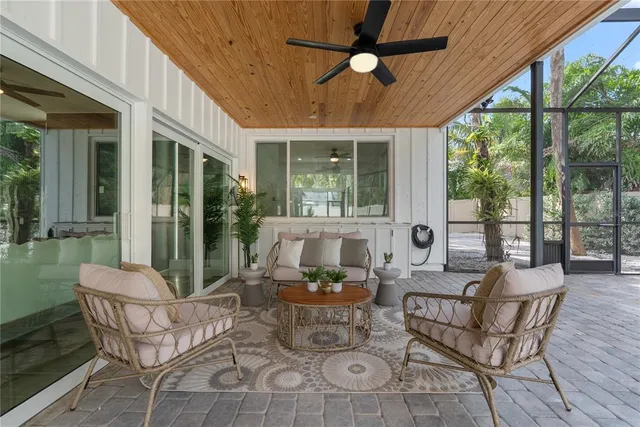 a outdoor space with patio the couches and a dining table with garden view