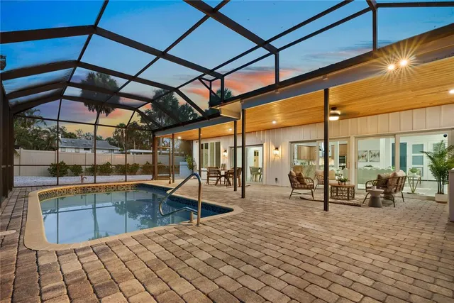 a view of a swimming pool with a patio