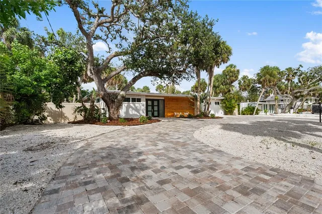 a view of outdoor space with deck and tree