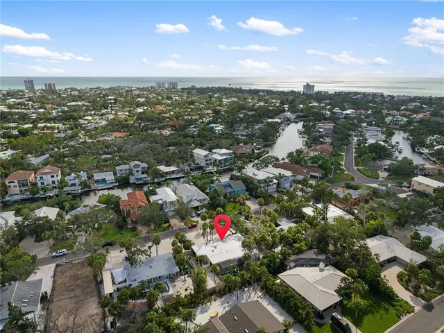 an aerial view of city and lake
