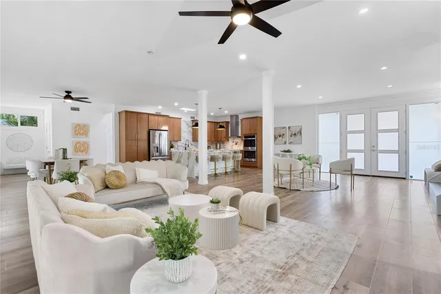 a living room with furniture and a large window