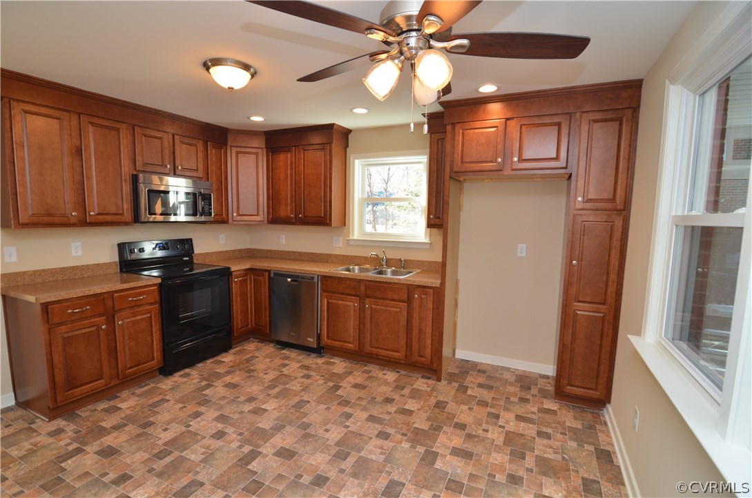 3308 Osborne Road Chester, VA 23831 - Photo 3 of 26 a kitchen with stainless steel appliances granite countertop a stove sink and cabinets