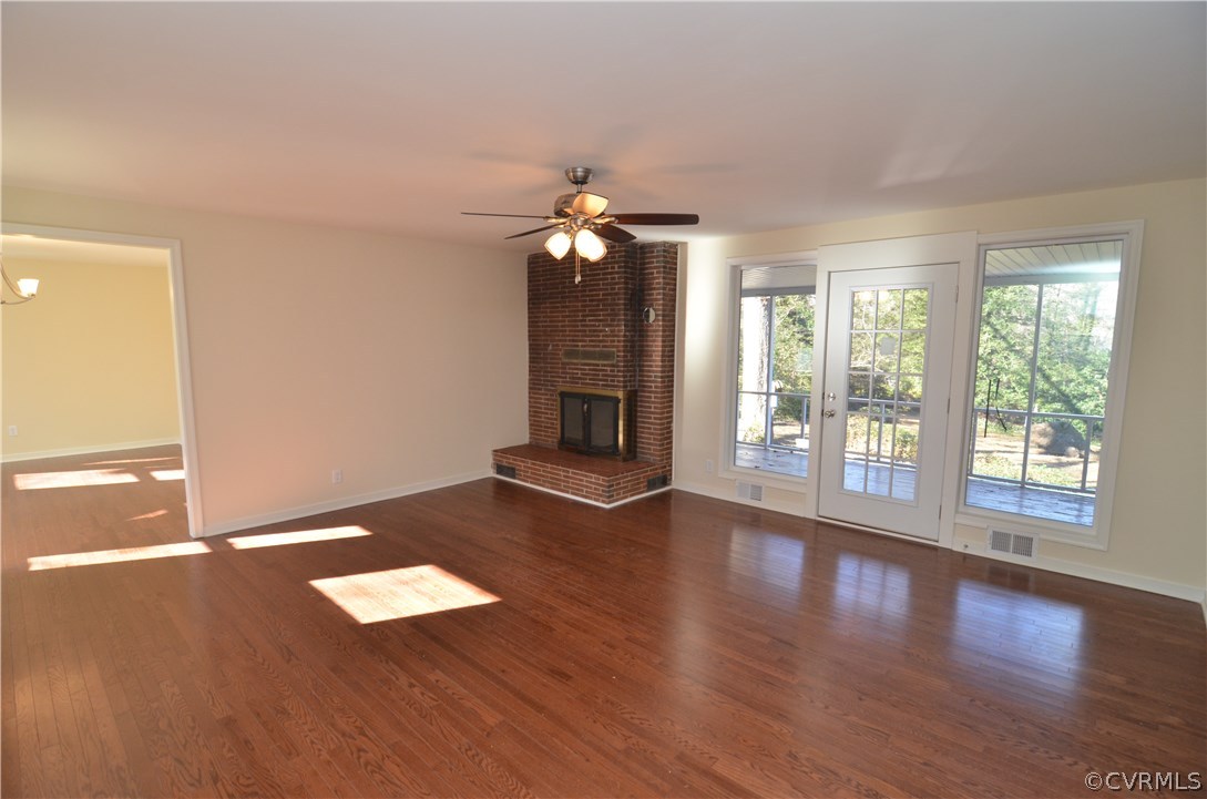 3308 Osborne Road Chester, VA 23831 - Photo 5 of 26 a view of an empty room with wooden floor and a window