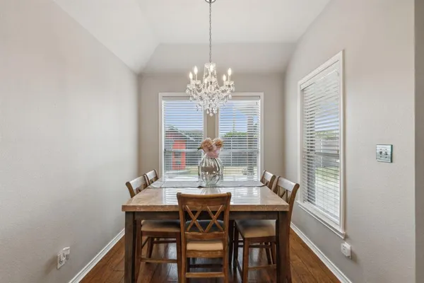 a kitchen with stainless steel appliances kitchen island granite countertop a stove and a refrigerator