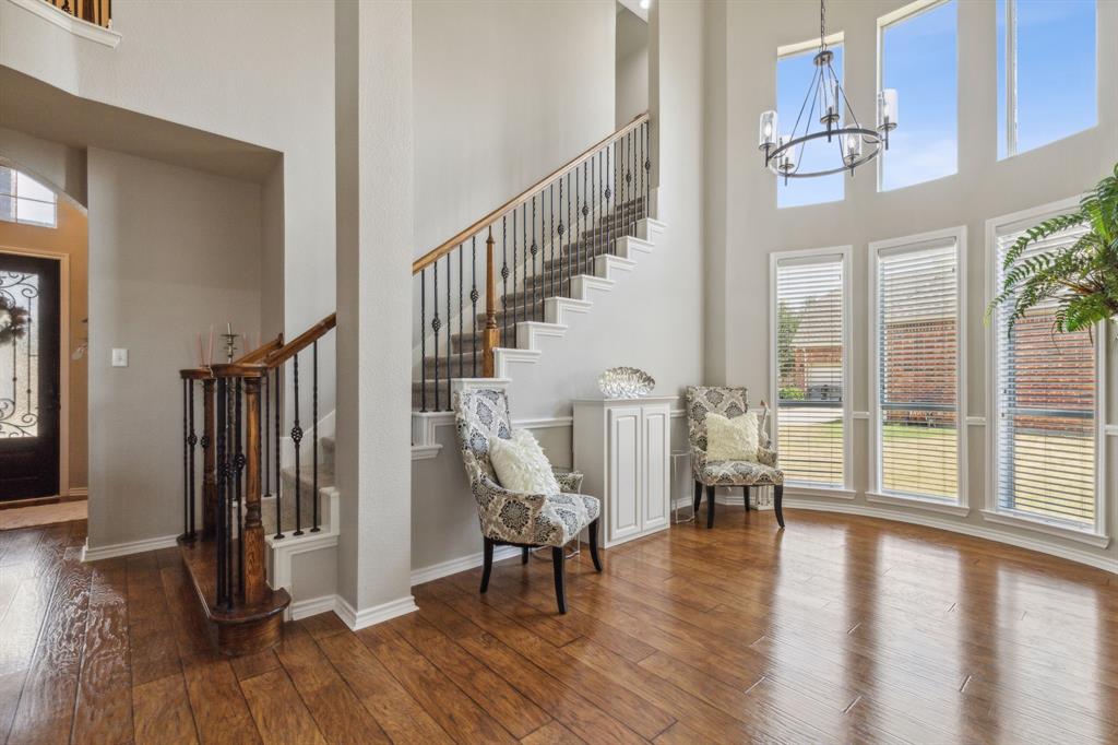 260 Dave Trail Prosper, TX 75078 - Photo 25 of 39 a view of entryway with wooden floor and windows