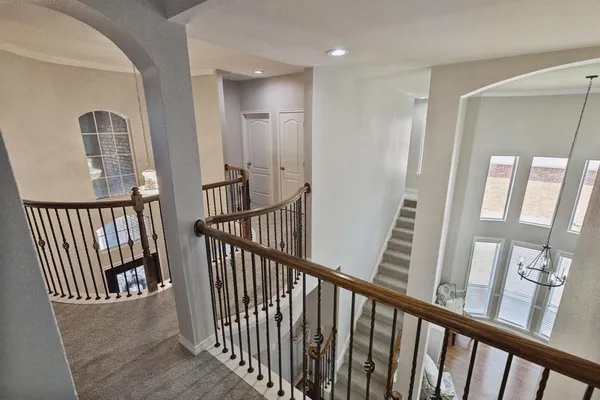 a view of entryway with wooden floor and windows