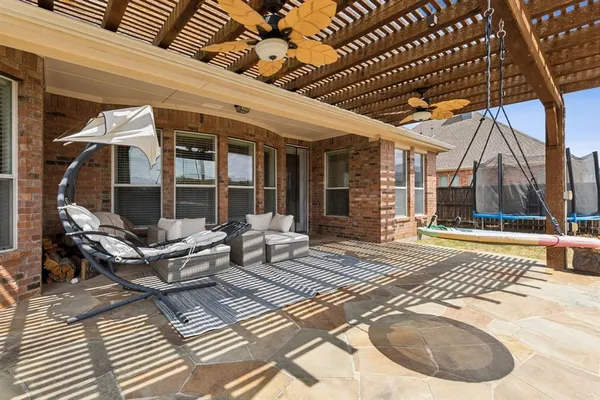 a view of a swimming pool with a lounge chairs