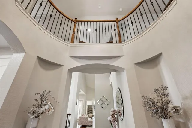 a view of staircase with white walls