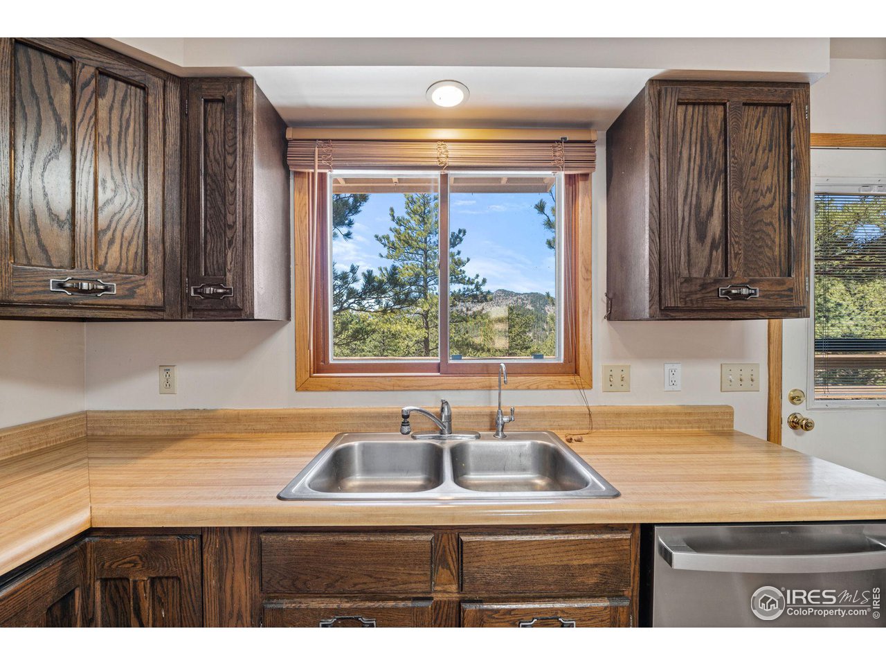 757 Peakview Road Boulder, CO 80302 - Photo 12 of 34 a kitchen with a sink a window and cabinets