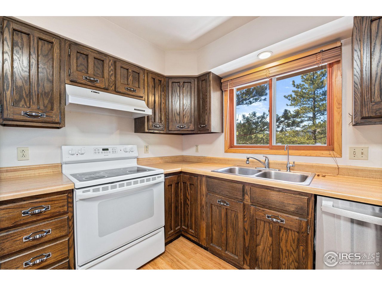 757 Peakview Road Boulder, CO 80302 - Photo 13 of 34 a kitchen with a sink stove and cabinets