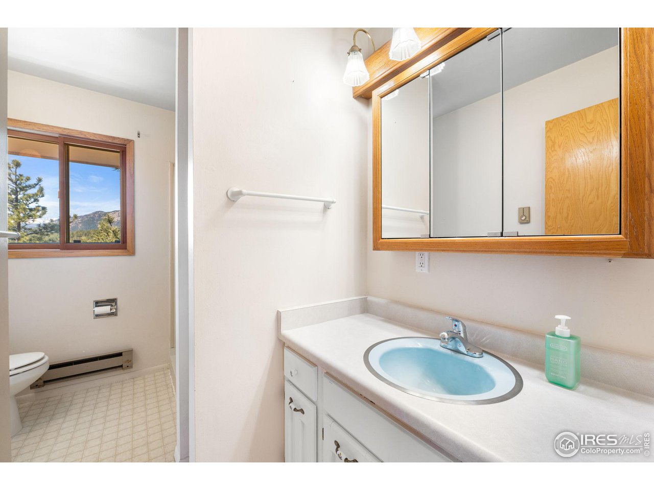 757 Peakview Road Boulder, CO 80302 - Photo 17 of 34 a bathroom with a sink and a mirror