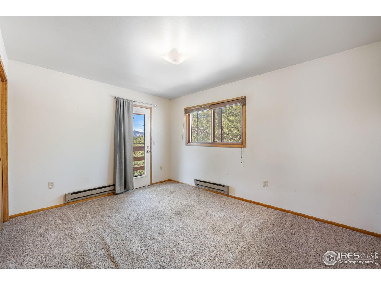 757 Peakview Road Boulder, CO 80302 - Photo 22 of 34 a view of an empty room with a window