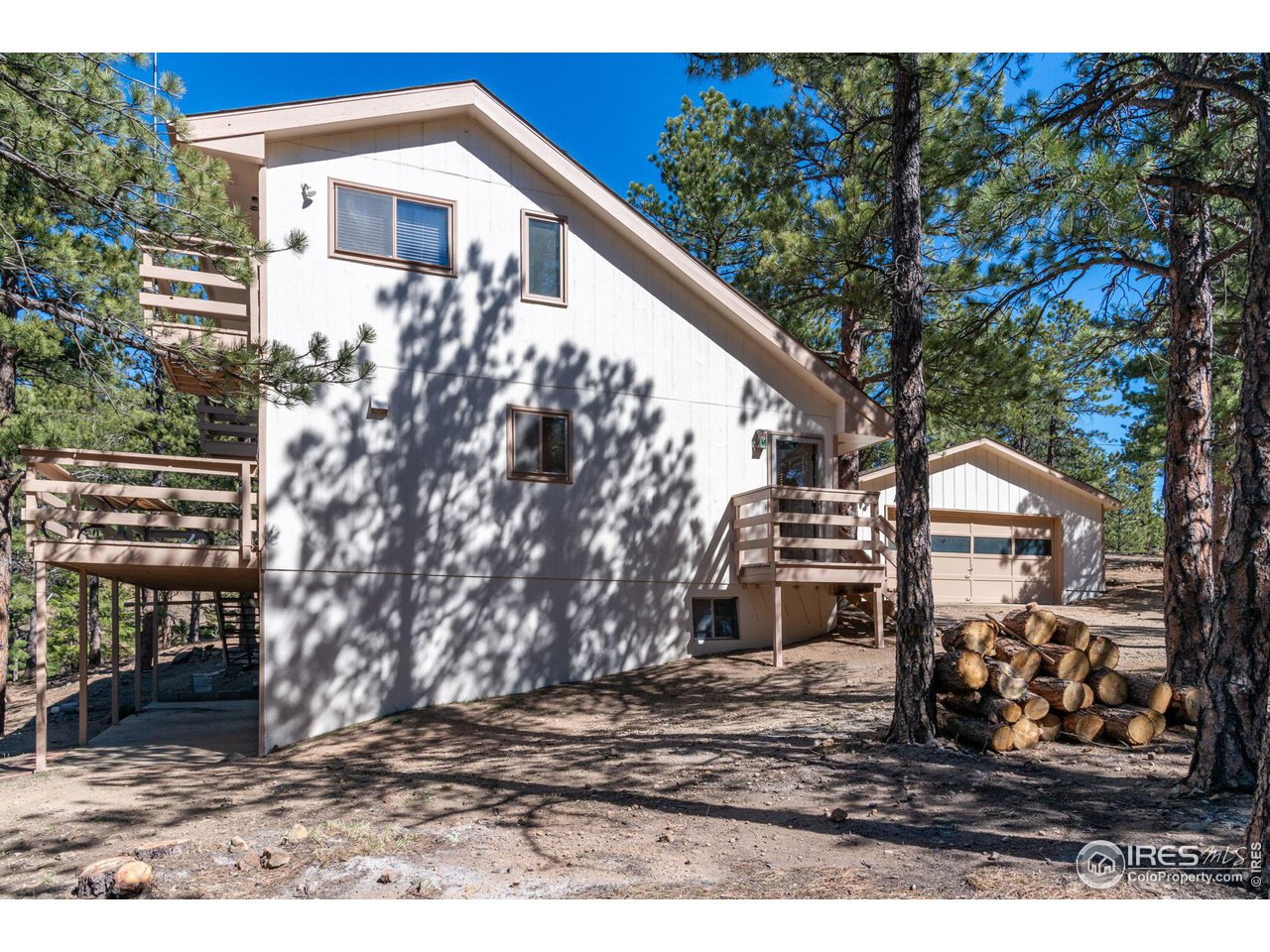 757 Peakview Road Boulder, CO 80302 - Photo 27 of 34 a view of a house with a yard
