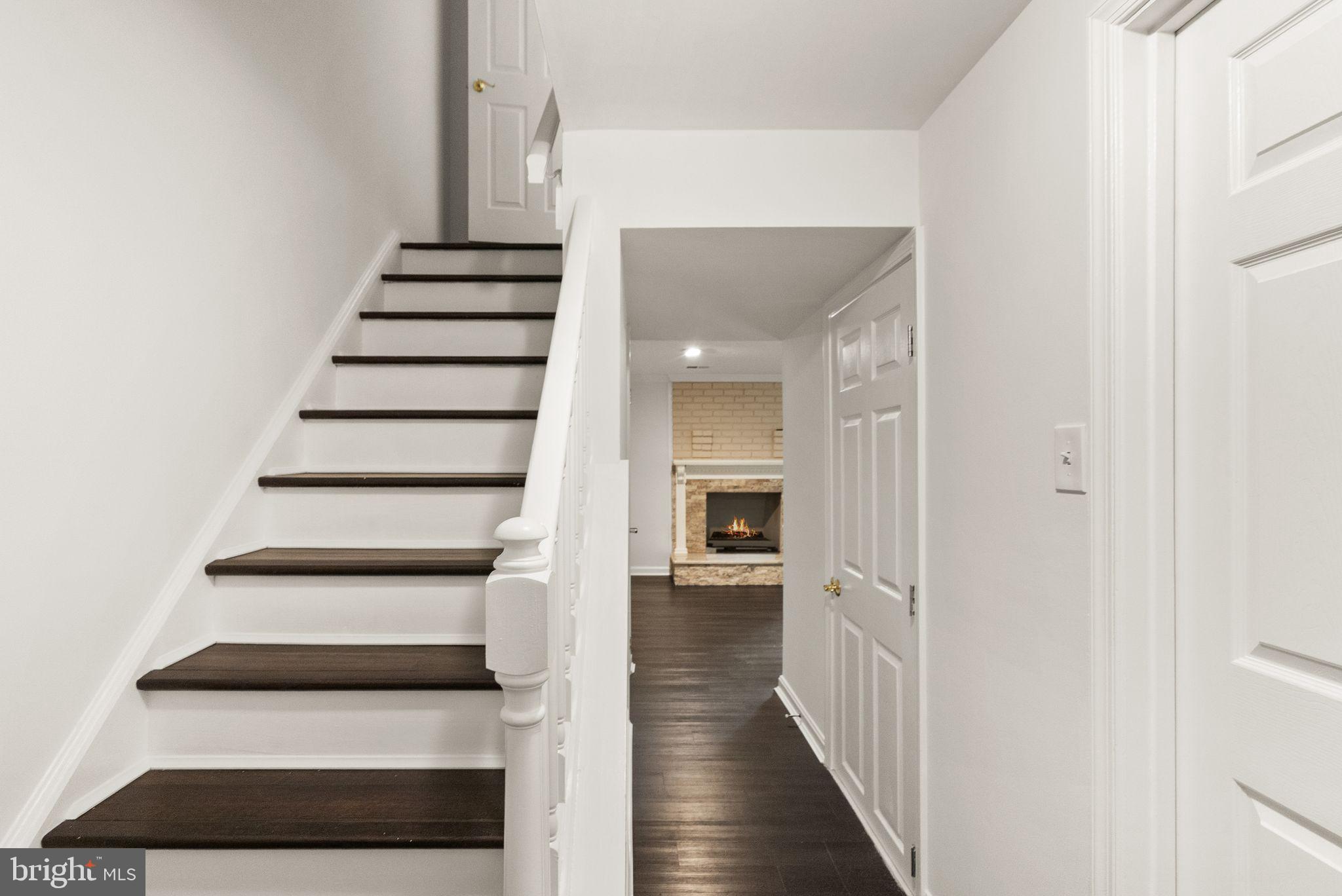 9507 Burdett Road Burke, VA 22015 - Photo 30 of 47 Lower level stair case and hallway