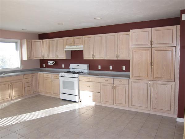 45 Half Crown Circle, Unit 45 Ashland, MA 01721 - Photo 17 of 19 a kitchen with white cabinets and white appliances