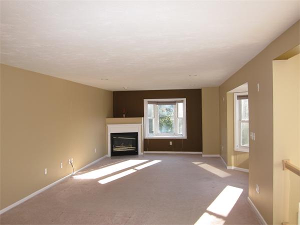 45 Half Crown Circle, Unit 45 Ashland, MA 01721 - Photo 4 of 19 an empty room with windows and fireplace