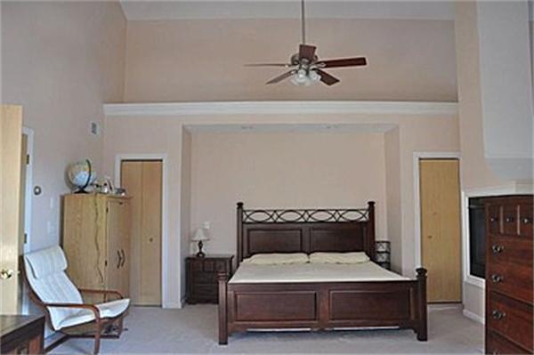 45 Half Crown Circle, Unit 45 Ashland, MA 01721 - Photo 7 of 19 a bedroom with a bed and a chair