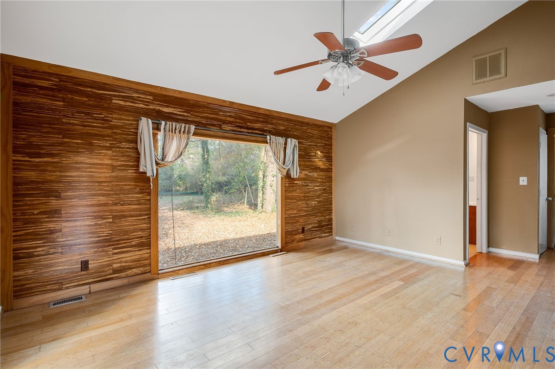1140 Berryhill Road Henrico, VA 23231 - Photo 11 of 29 Unfurnished room featuring wood walls, high vaulte