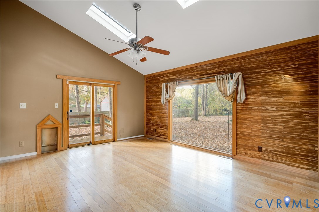 1140 Berryhill Road Henrico, VA 23231 - Photo 13 of 29 Spare room featuring high vaulted ceiling, a skyli