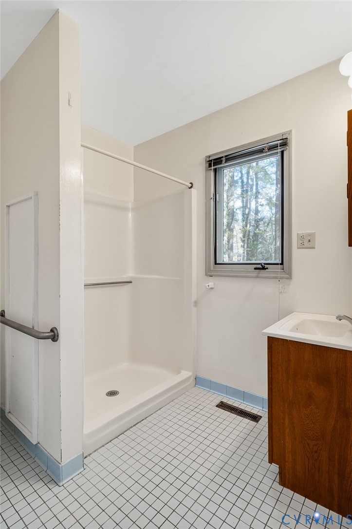 1140 Berryhill Road Henrico, VA 23231 - Photo 14 of 29 Full bathroom featuring vanity, light tile pattern