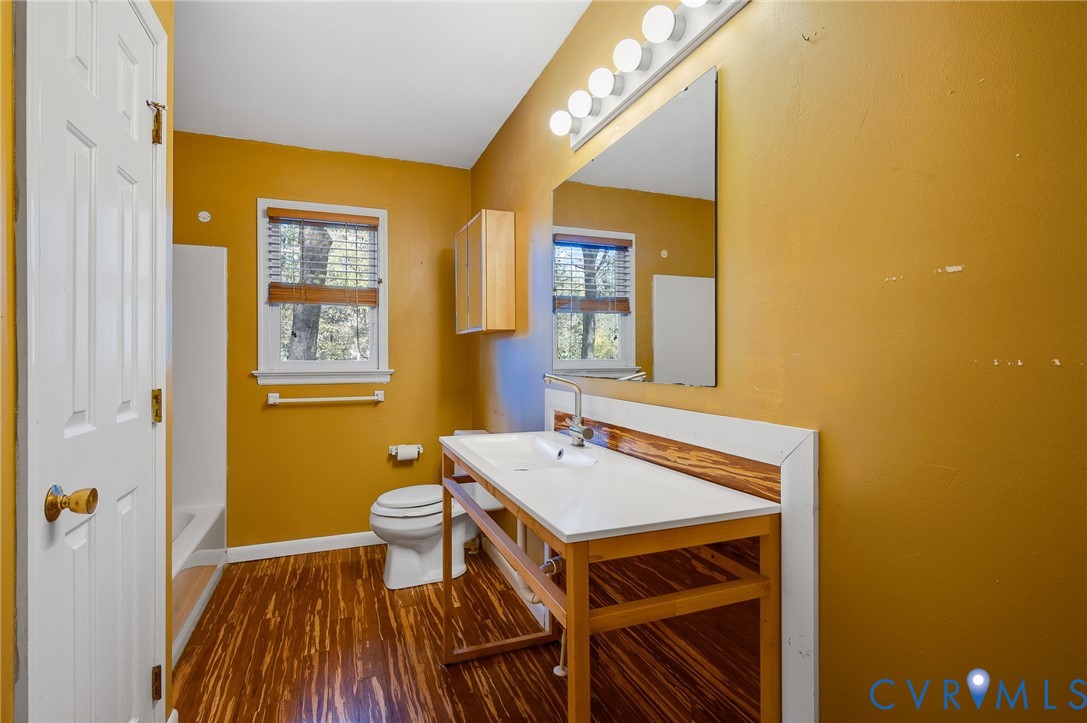 1140 Berryhill Road Henrico, VA 23231 - Photo 15 of 29 Bathroom with dark wood finished floors, vanity, a