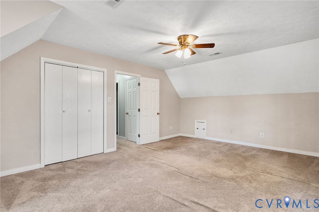 1140 Berryhill Road Henrico, VA 23231 - Photo 25 of 29 Bonus room featuring lofted ceiling, light carpet,