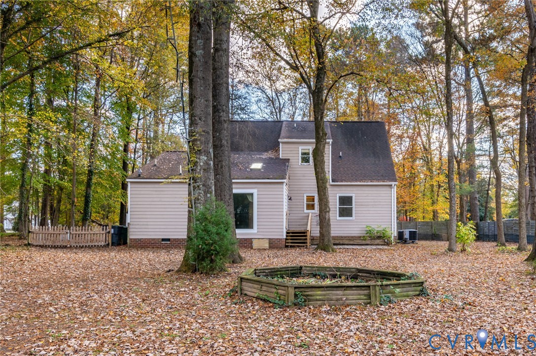 1140 Berryhill Road Henrico, VA 23231 - Photo 26 of 29 Rear view of house with a shingled roof, a garden,