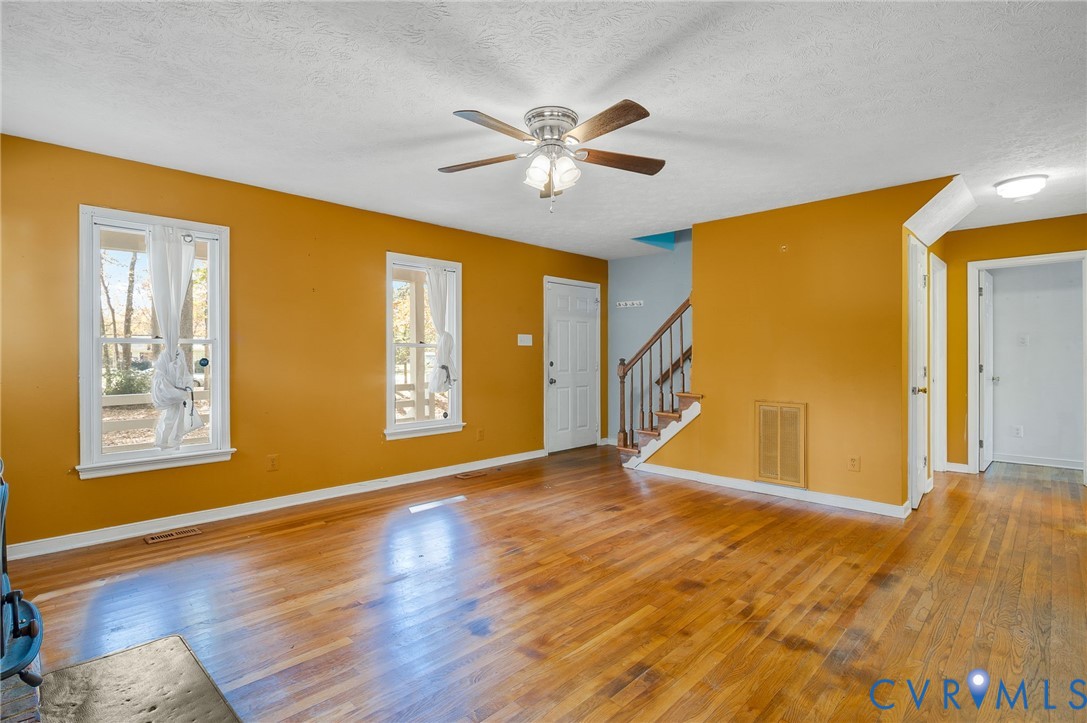 1140 Berryhill Road Henrico, VA 23231 - Photo 6 of 29 Unfurnished living room featuring light wood-style