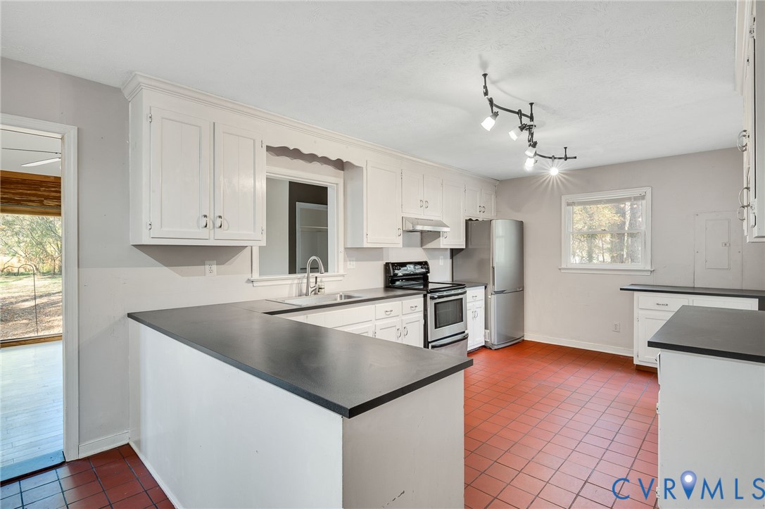 1140 Berryhill Road Henrico, VA 23231 - Photo 8 of 29 Kitchen with dark tile patterned floors, dark coun