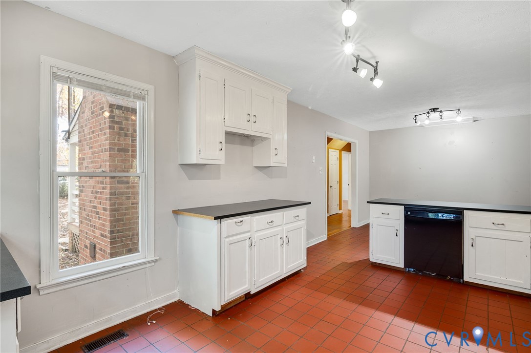 1140 Berryhill Road Henrico, VA 23231 - Photo 10 of 29 Kitchen with dishwasher, white cabinetry, dark til
