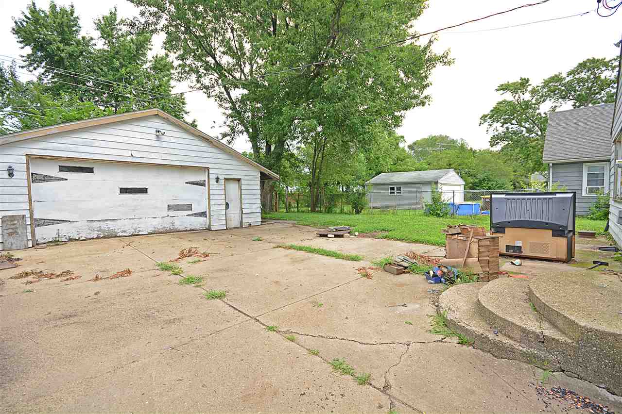 916 Windsor Road Loves Park, IL 61111 - Photo 12 of 14 a house view with a backyard space