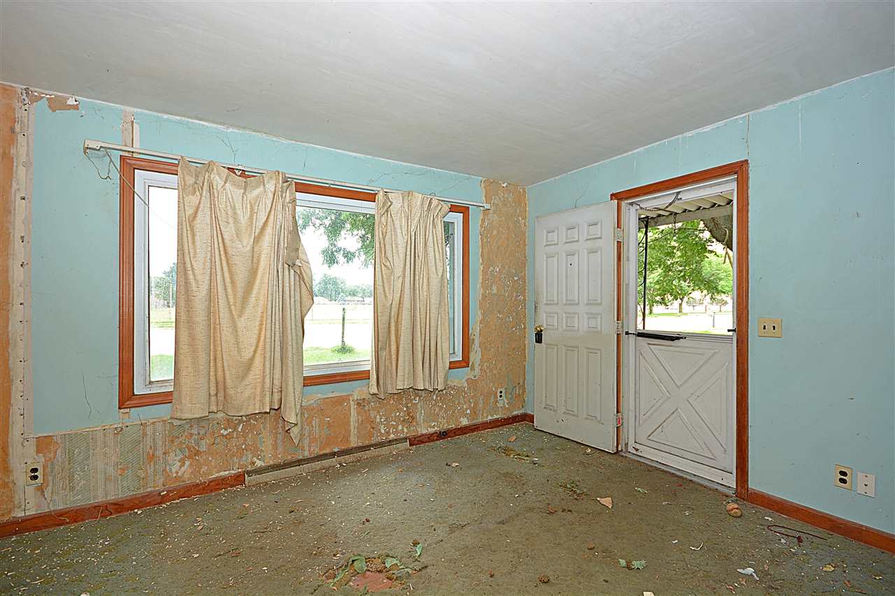 916 Windsor Road Loves Park, IL 61111 - Photo 3 of 14 an empty room with windows