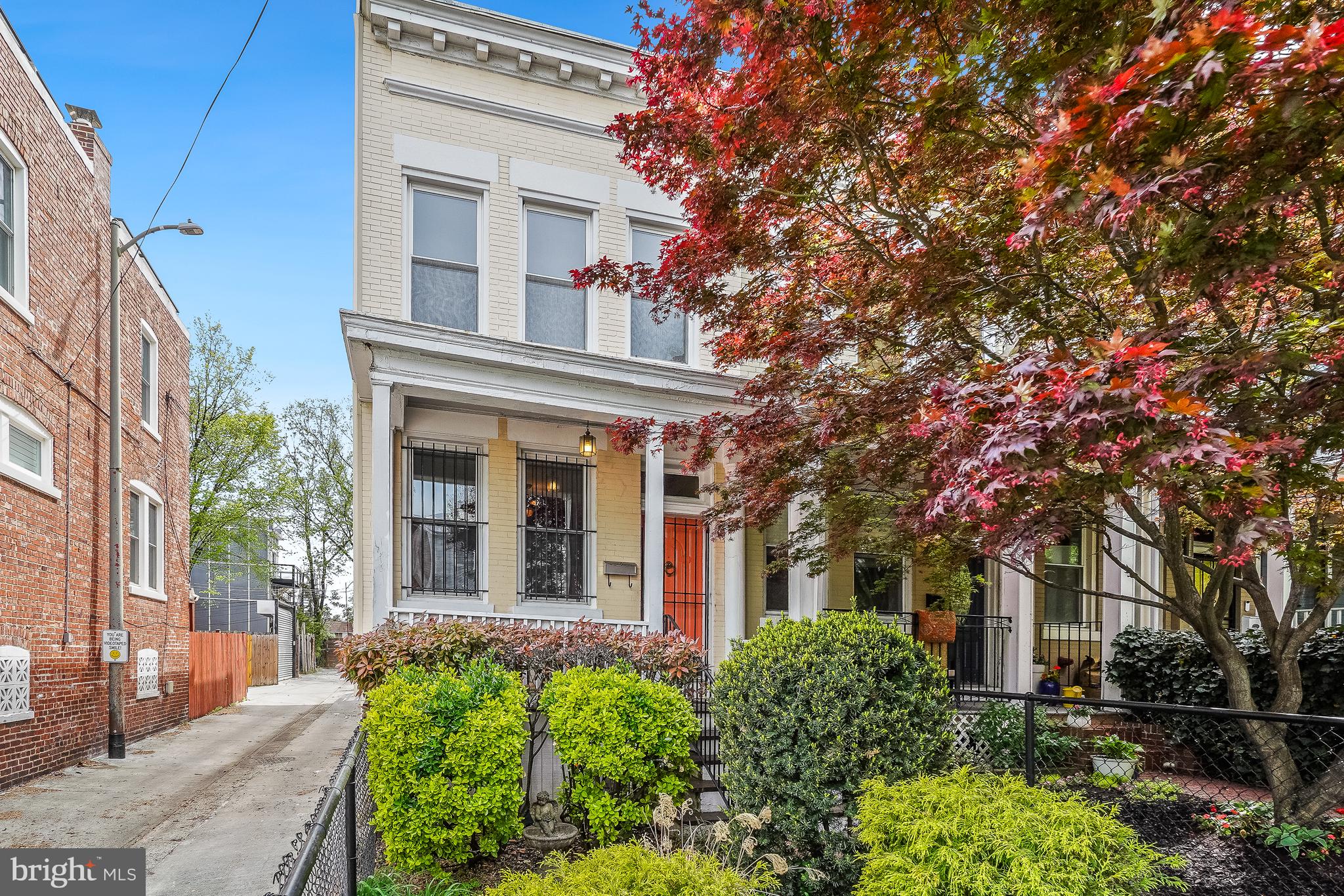 front view of a house with a tree
