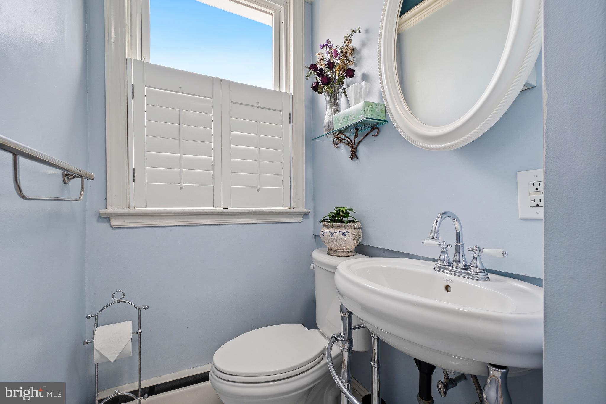 323 W Street Northeast Washington, DC 20002 - Photo 14 of 22 a bathroom with a sink a toilet and a mirror