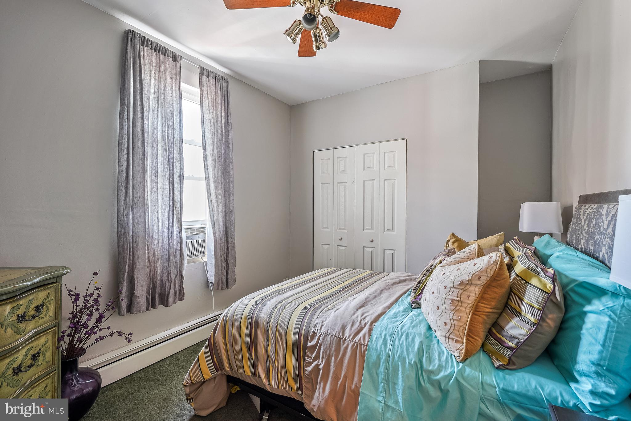323 W Street Northeast Washington, DC 20002 - Photo 15 of 22 a bedroom with a bed and a window