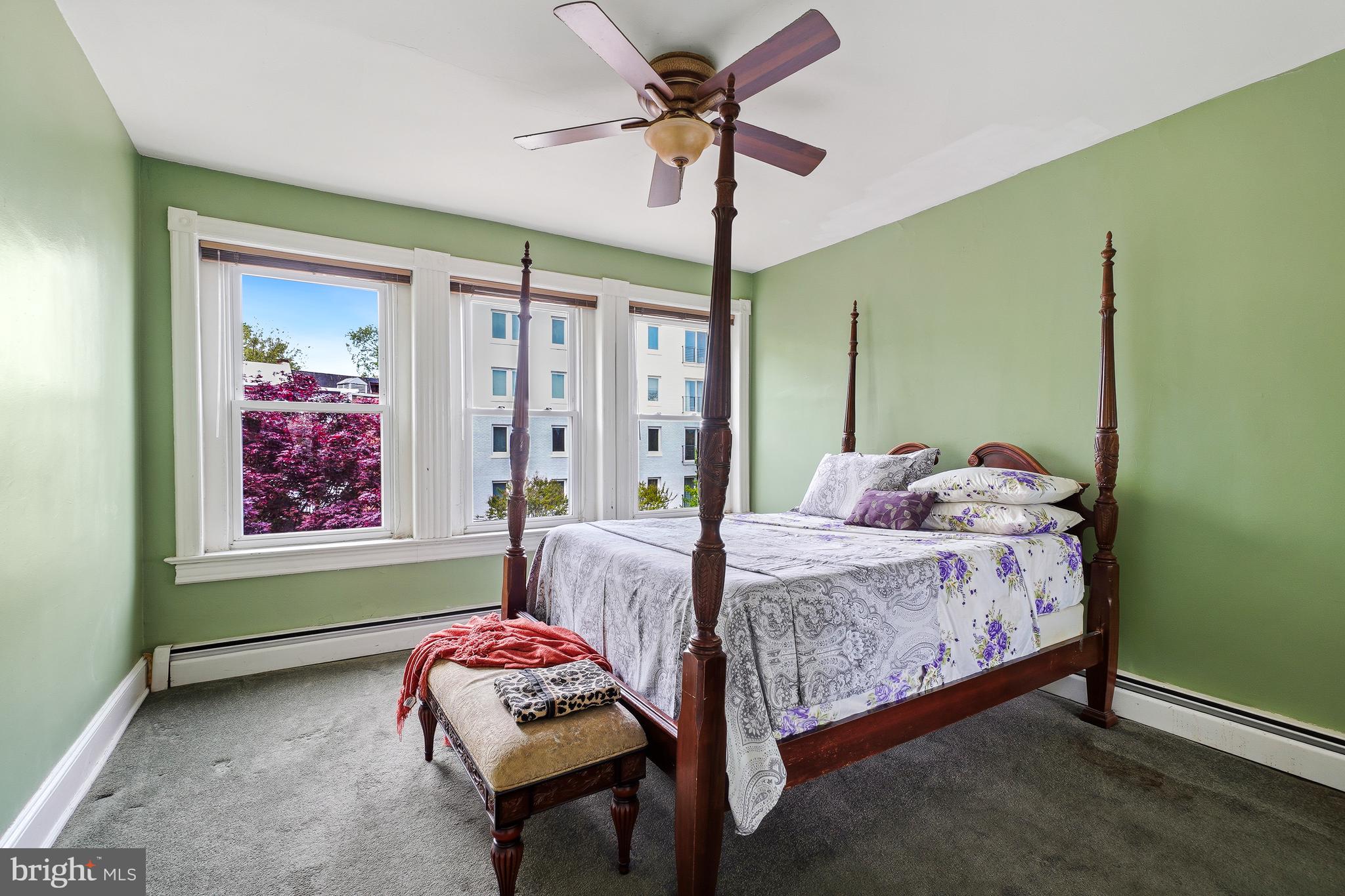 323 W Street Northeast Washington, DC 20002 - Photo 16 of 22 a bedroom with a bed and a chandelier