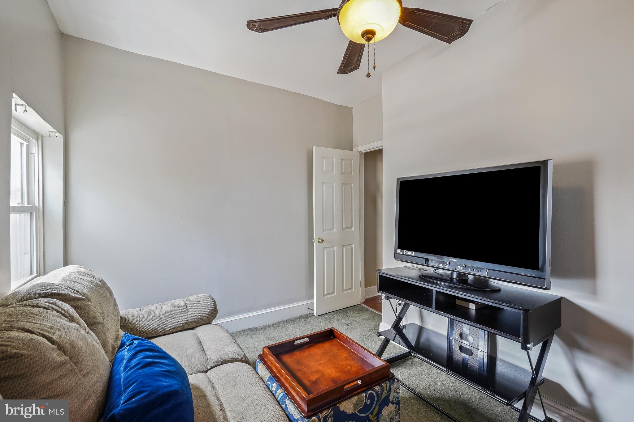 323 W Street Northeast Washington, DC 20002 - Photo 19 of 22 a living room with furniture and a flat screen tv
