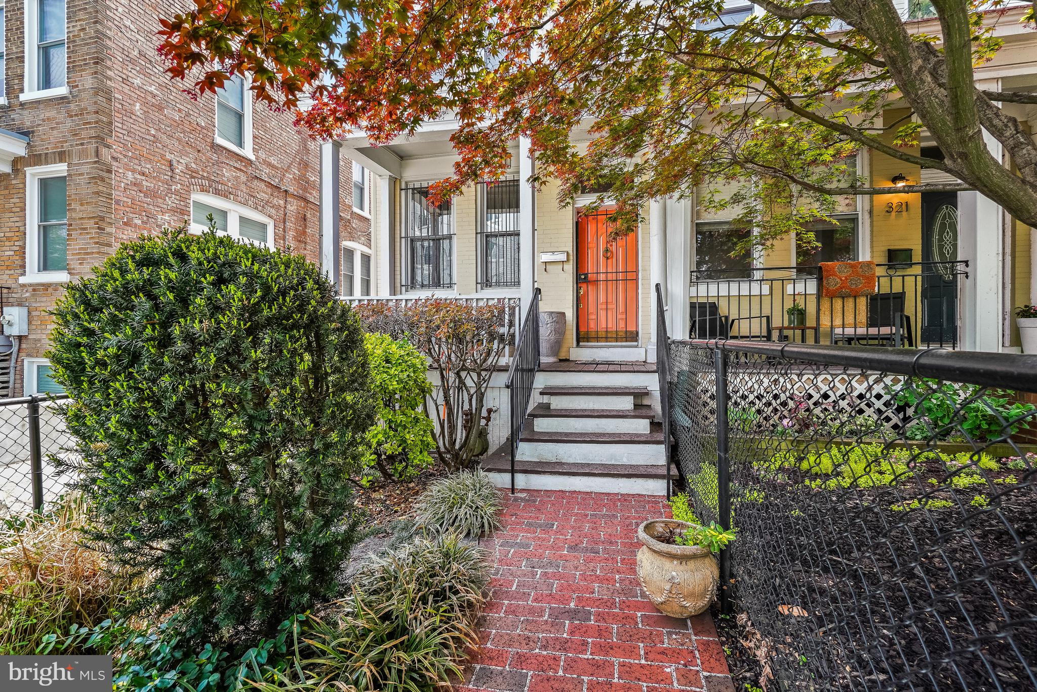 323 W Street Northeast Washington, DC 20002 - Photo 2 of 22 a front view of a house with a garden